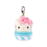 This charming Hello Kitty Snack Plush - Blind Bag keychain resembles a cupcake with a pink bow and blue-striped base. It features beloved Sanrio characters and includes a durable metal clasp for easy attachment.