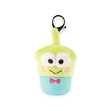 The Hello Kitty Snack Plush - Blind Bag features a green alien-shaped keychain with big eyes, pink cheeks, and a pink bow tie, resembling a drink with a straw. A whimsical addition to your Hello Kitty collection!.