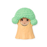 A Sylvanian Families Blind Bag figure from the Blooming Baby Friends collection is dressed like a broccoli, featuring a green top and beige body.