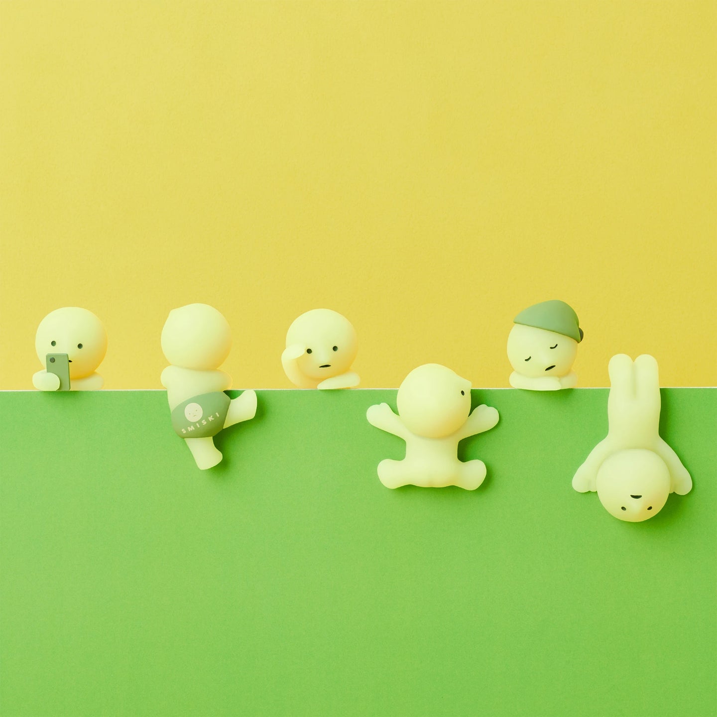 Row of Smiski Hippers blind box figurines posed on a shelf