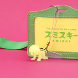 Light green Smiski strap keychain figure with metal clasp and ring, on green strap