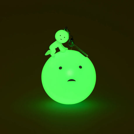 Glow green Smiski character keychain with small loop clasp