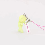 Lemon-green Smiski keychain figure with pink lanyard strap and small charm tag