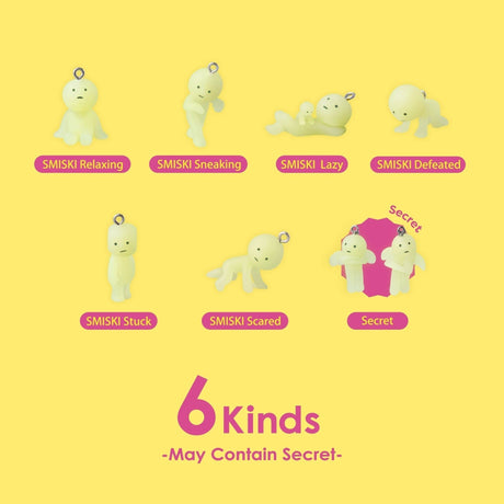 Set of Smiski-style strap keychains with small figures in different poses