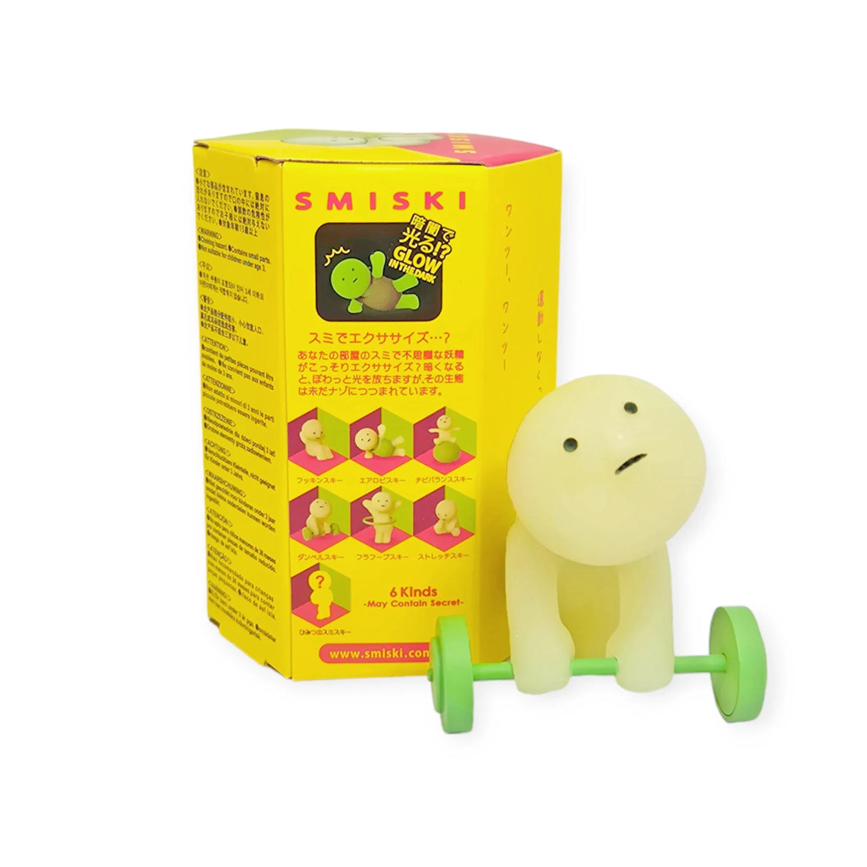 A figure from the Smiski Exercising Series - Blind Box by Smiski lifts a green barbell next to its yellow packaging, providing ideal workout inspiration.