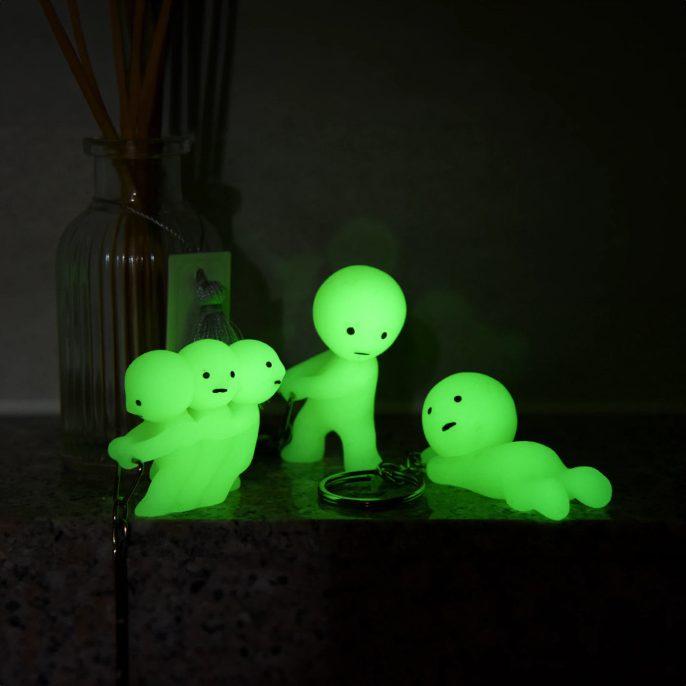 Neon green Smiski keychain figure crouching with metal key ring
