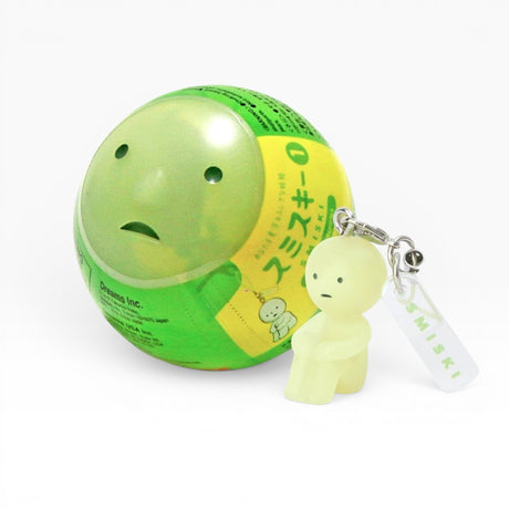 Smiski-style figure keychain attached to a green ball charm