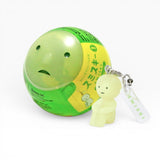 Green character strap keychain with small figure and white label tag