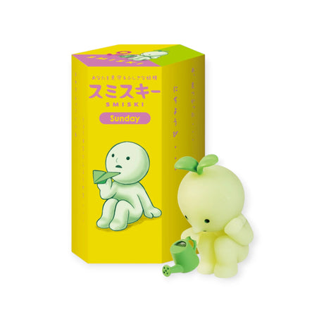 The Smiski Sunday Series Blind Box contains a green Smiski figurine that glows in the dark, paired with a toy watering can and packaged in a "Sunday" labeled box, offering an element of surprise.