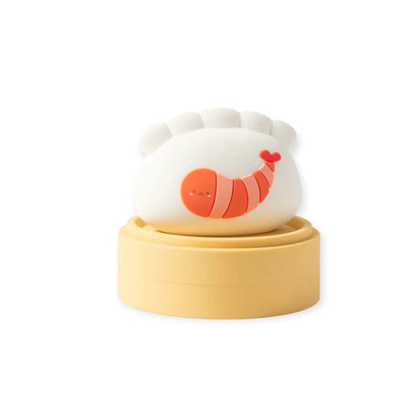 Smoko Dim Sum Friends vinyl figure shaped like a shrimp dumpling sitting on a round tan steamer base against white background