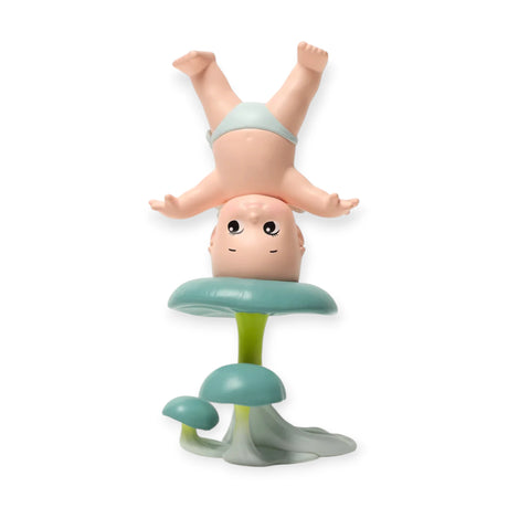 Kewpie blind box figurine: baby upside down on green leaf pedestal
