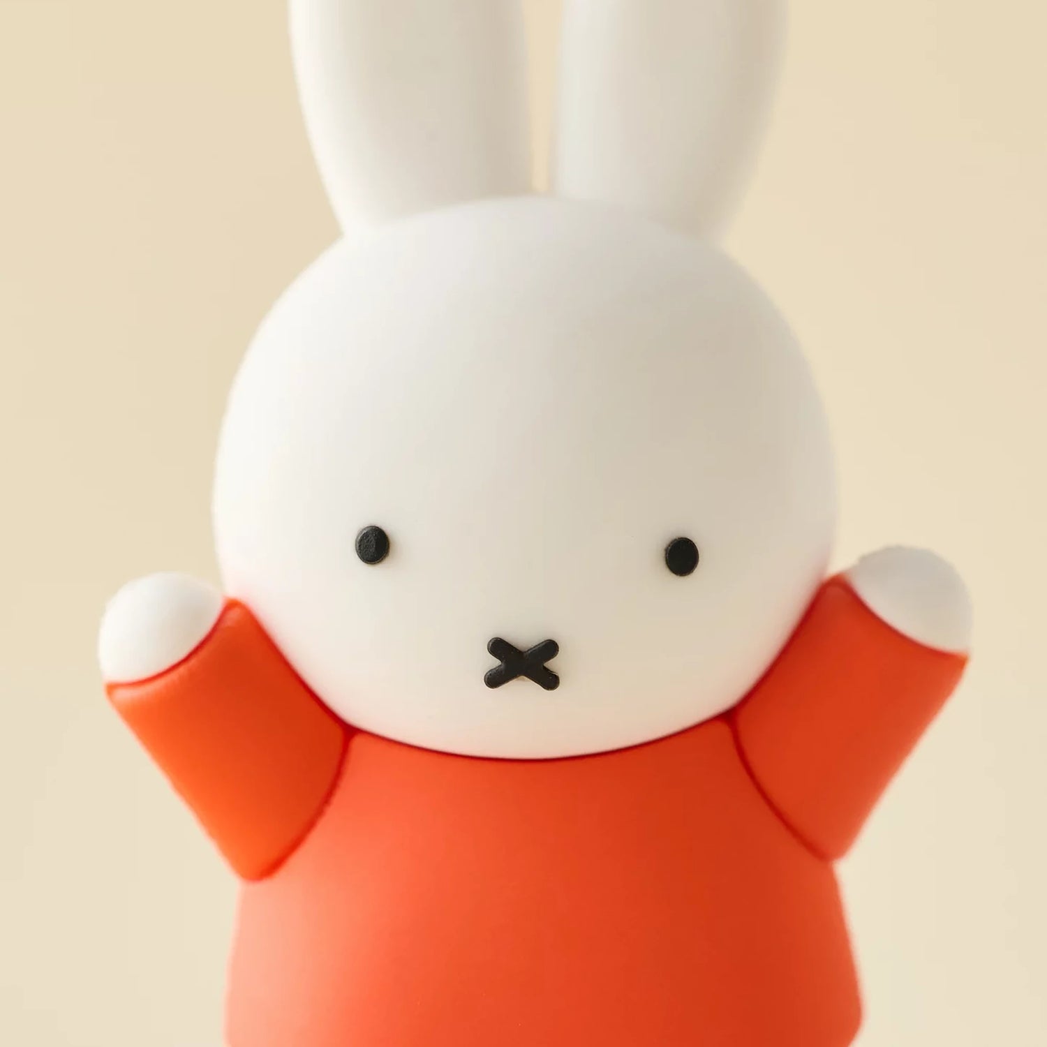 Close-up rabbit blind box figure face with orange outfit