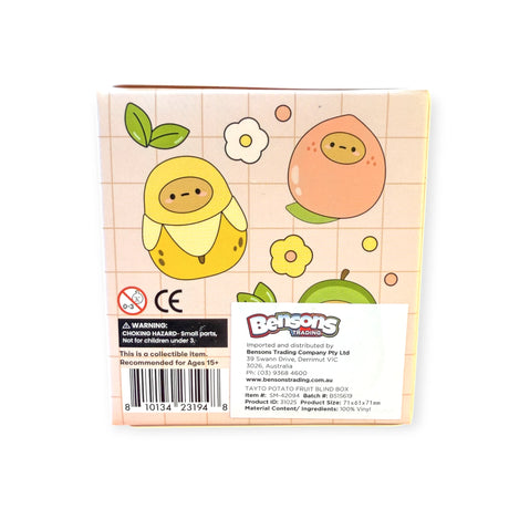 The Smoko Tayto Fruit Blind Box features cartoon fruit characters, a product label, barcode, and a warning that Smoko Tayto Vinyl Figures are recommended for ages 15 and up.