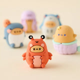 Orange bear-like mini blind box figure with black antennae and smiling face