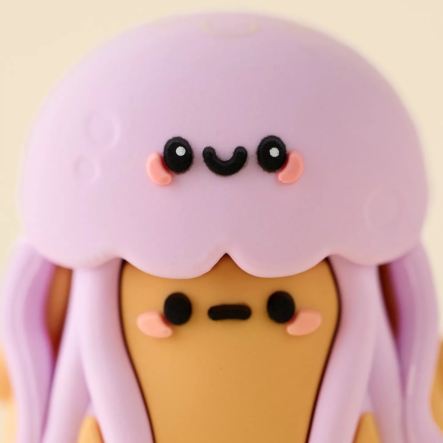 Purple jellyfish mini blind box figure with smiling face and tentacle details