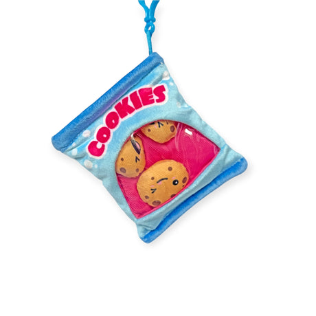 The Bensons Snack Bites Bag Charm is a blue plush keychain shaped like a cookie bag. It features cartoon cookie faces and the word "Cookies" in red, adding a playful touch to your accessories.