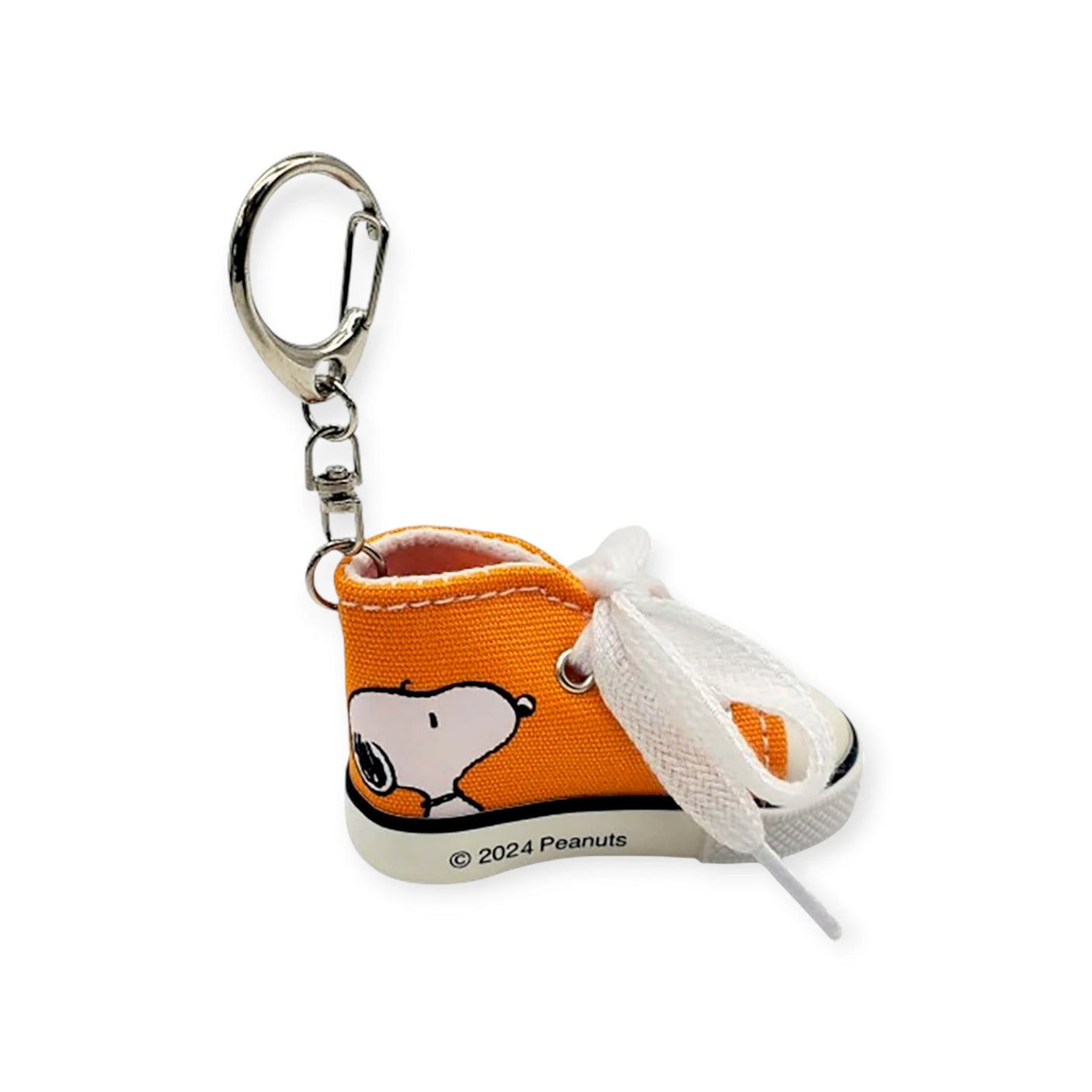 The Snoopy Orange Kicks Keychain showcases Snoopy on an orange mini sneaker with a white lace and sturdy metal keyring. A charming accessory for Peanuts fans, it's perfect for adding whimsy and style.