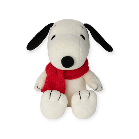 The Snoopy Scarf Plush by Snoopy, standing 17cm tall, features black ears and a vibrant red scarf. It is crafted from recycled polyester and sits upright against a white backdrop, exuding the charm and quality of Bon Ton Toys.