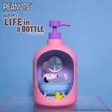 Pink pump bottle diorama with Snoopy relaxing in blue bathtub and yellow rubber duck on blue background