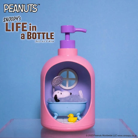 Pink pump bottle diorama with Snoopy relaxing in blue bathtub and yellow rubber duck on blue background
