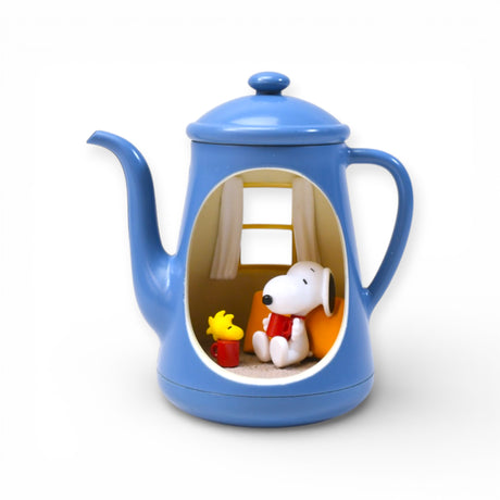 Blue teapot diorama with Snoopy and Woodstock sitting with red mugs inside cozy room scene