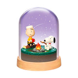 Purple night glass terrarium with Snoopy camping by a small fire, on wooden base