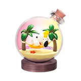 Pink beach glass terrarium with Snoopy and Woodstock holding items, on wooden base