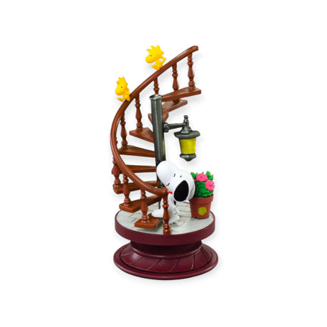 Snoopy and two Woodstocks on a spiral staircase with a street lamp and flower pot on rotating base