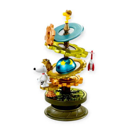 Intricate Snoopy spiral diorama featuring Woodstock, Snoopy, and space-themed elements on rotating gear-like platforms