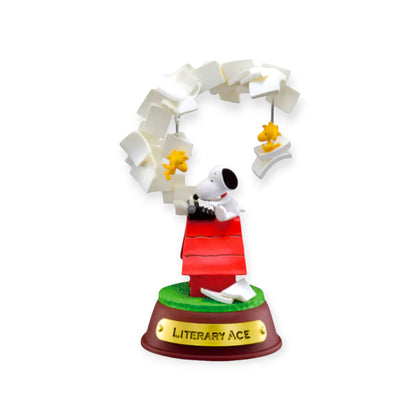 Swing ornament figurine with white letter halo, red shirt, and Literary Ace base
