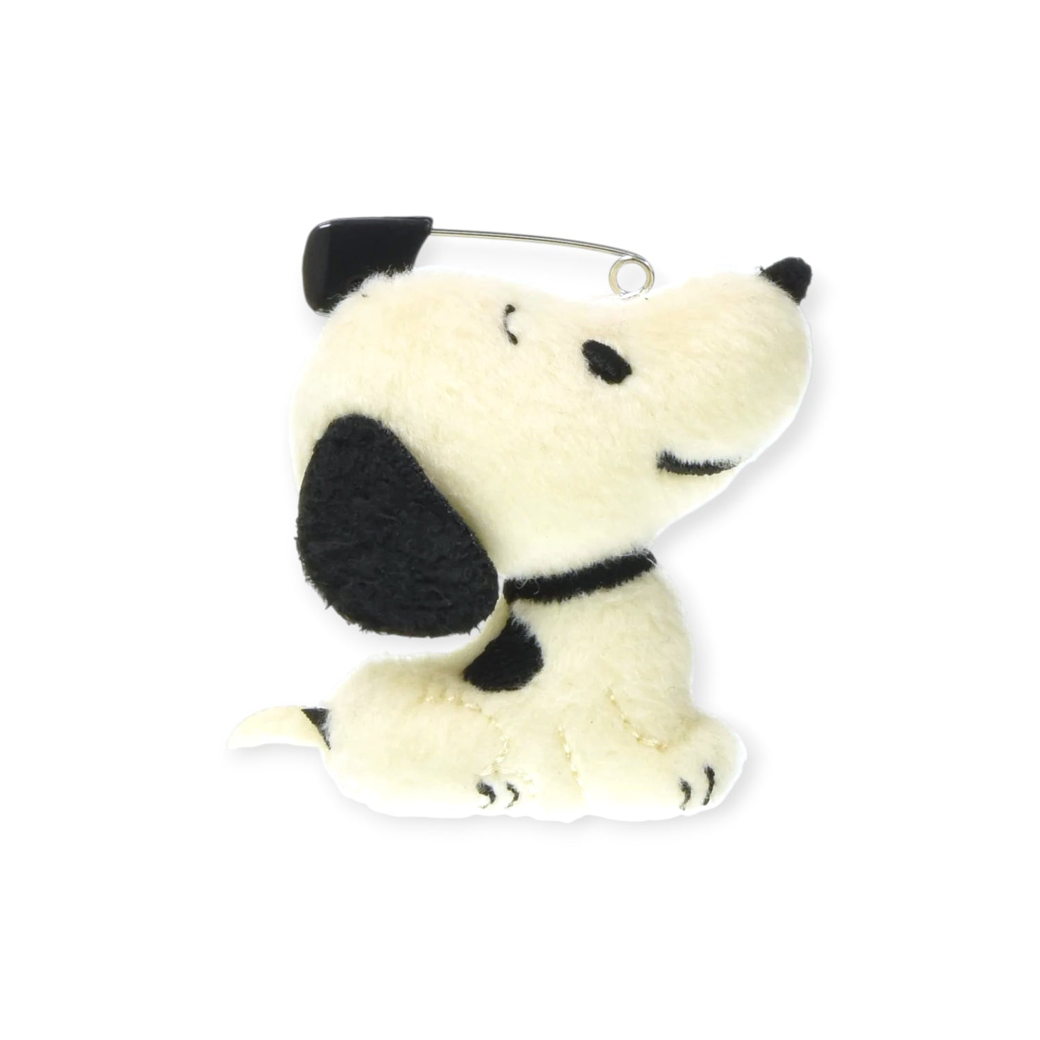 The Snoopy Vintage Plush Pin by Snoopy features a retro-style dog keychain with black ears, nose, and spots, sitting upright with a safety pin on its back, displayed on a white background.