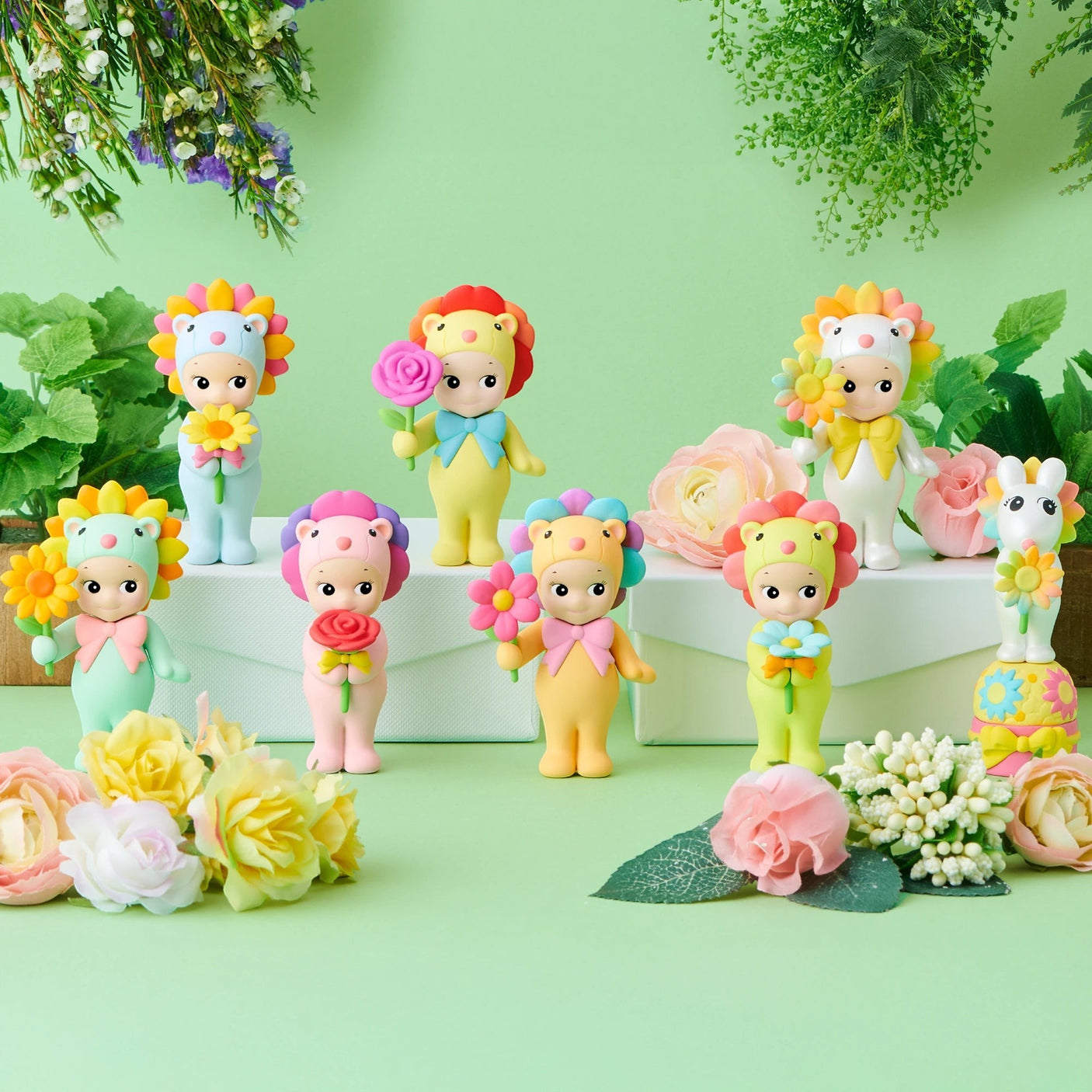 Group of flower-themed Sonny Angel mini figures standing together with pastel rose accents