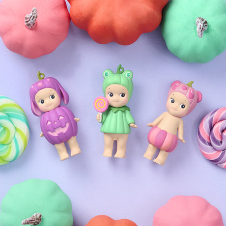 Sonny Angel Halloween mini figures with lollipop props on a purple surface