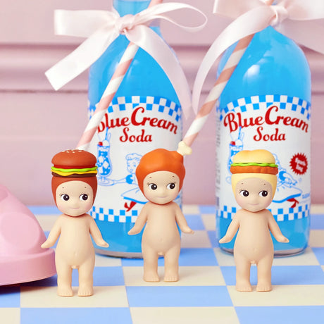 Three Sonny Angel Snack Series - Blind Box mini-figures from Sonny Angel, two with burger and sandwich hats and one bareheaded, stand before blue cream soda bottles—a charming surprise collectible set.
