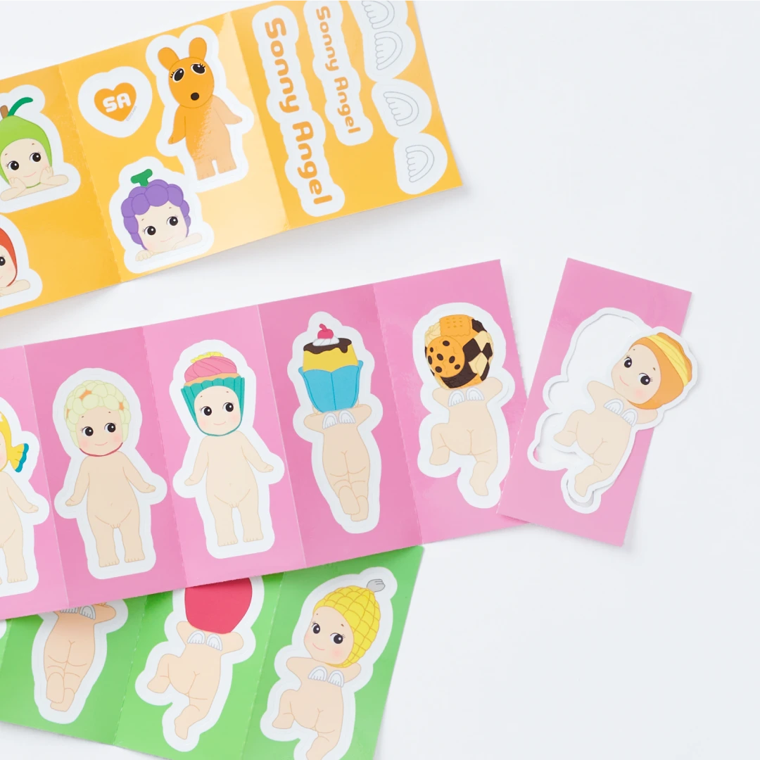 Explore the captivating realm of Sonny Angel Blind Box - Sticker Pack Series 2 by Sonny Angel, showcasing an array of vibrant cartoons with baby figures donning adorable themed costumes such as animals and food items. These durable, water-resistant stickers are a charming addition to any collection.