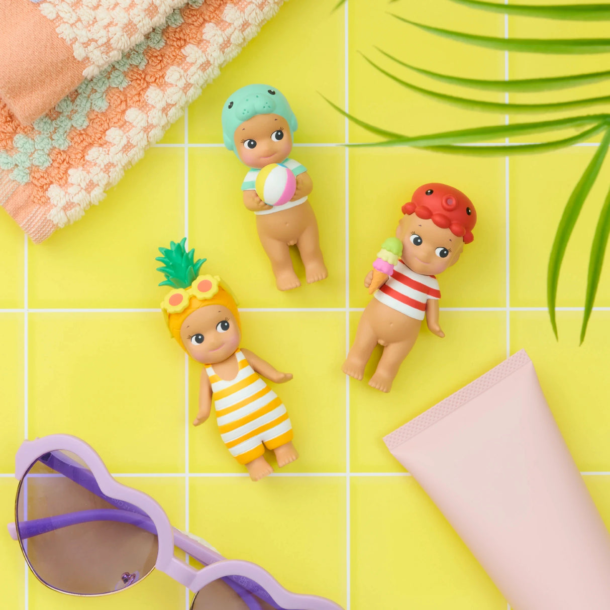Sonny Angel Summer Vacation Sun Kissed figurines, striped swimsuits with towels and shell props