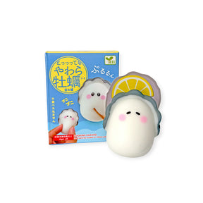 Front view of Squishy Oyster Blind Box featuring soft oyster toy with lemon slice on white background, gallery image one