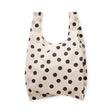 White polka dot reusable tote bag with U-shaped opening, dark spots