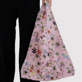 BAGGU tote bag held in hand, pink floral and butterfly print