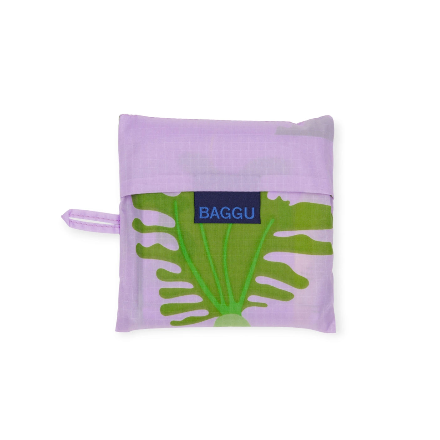 The folded Standard Baggu Bag - Daikon Pink by Baggu, made from recycled ripstop nylon with a purple and green floral pattern, is neatly stored in its compact pouch.