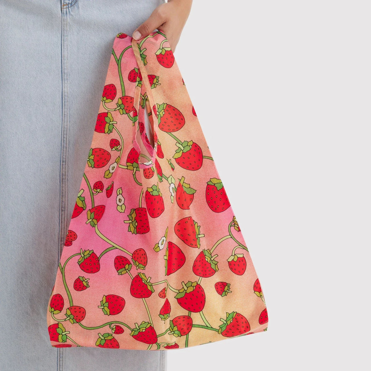 Strawberry print tote bag with gathered top and long handle, peach-pink fabric