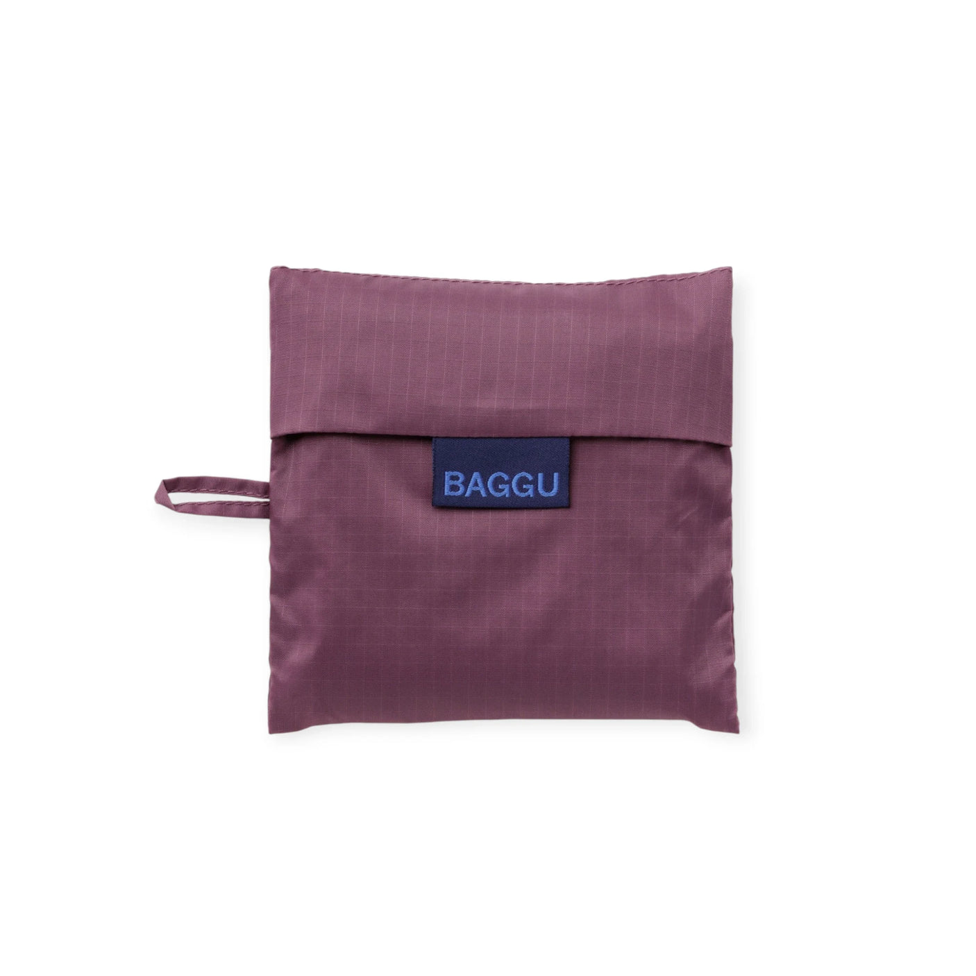 Baggu Standard bag folded into pouch in wild plum, blue Baggu logo label