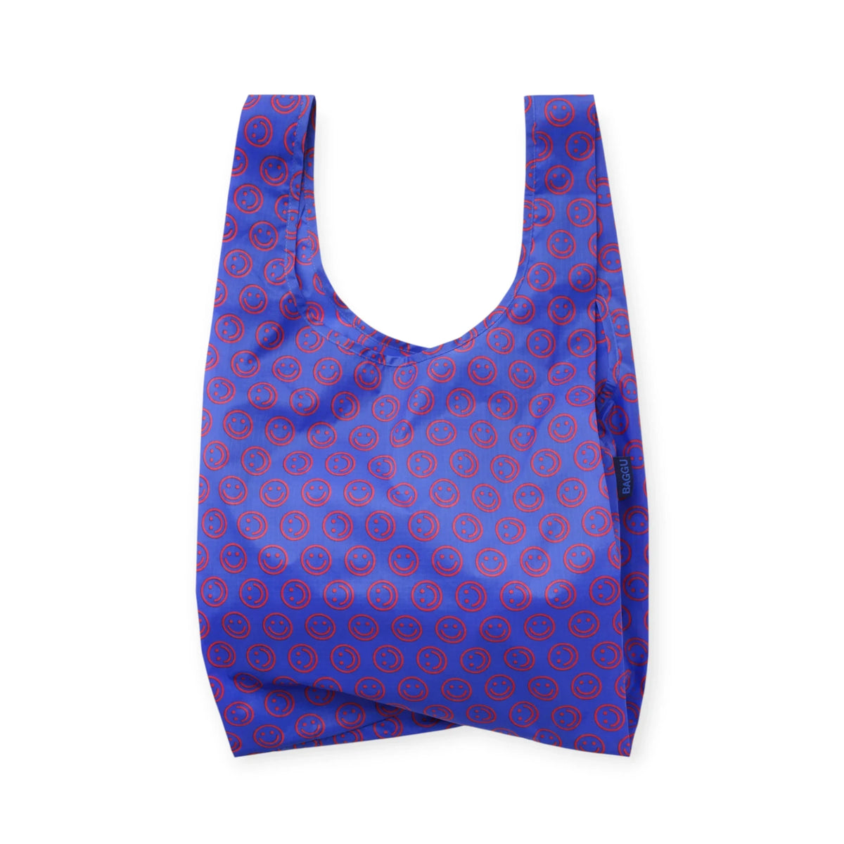Mini reusable tote bag in cobalt blue with red smiley circle pattern