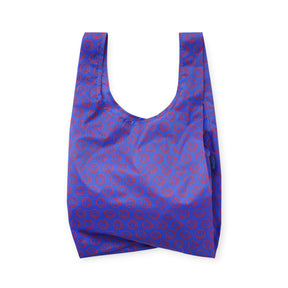 Mini reusable tote bag in cobalt blue with red smiley circle pattern