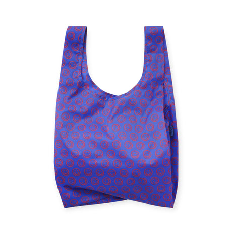 Mini reusable tote bag in cobalt blue with red smiley circle pattern