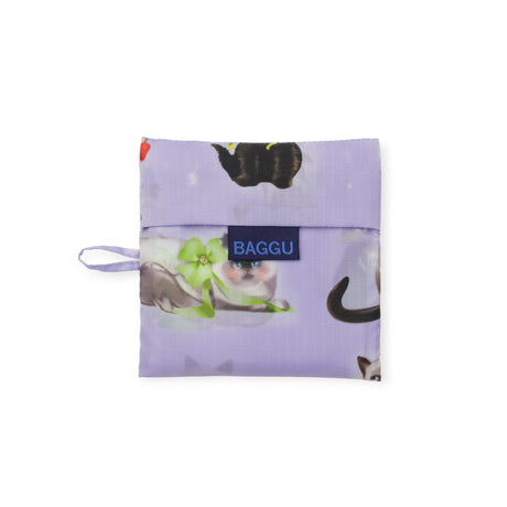 Folded lilac Standard Baggu bag featuring airbrushed cats with colorful ribbon bows and blue Baggu logo patch