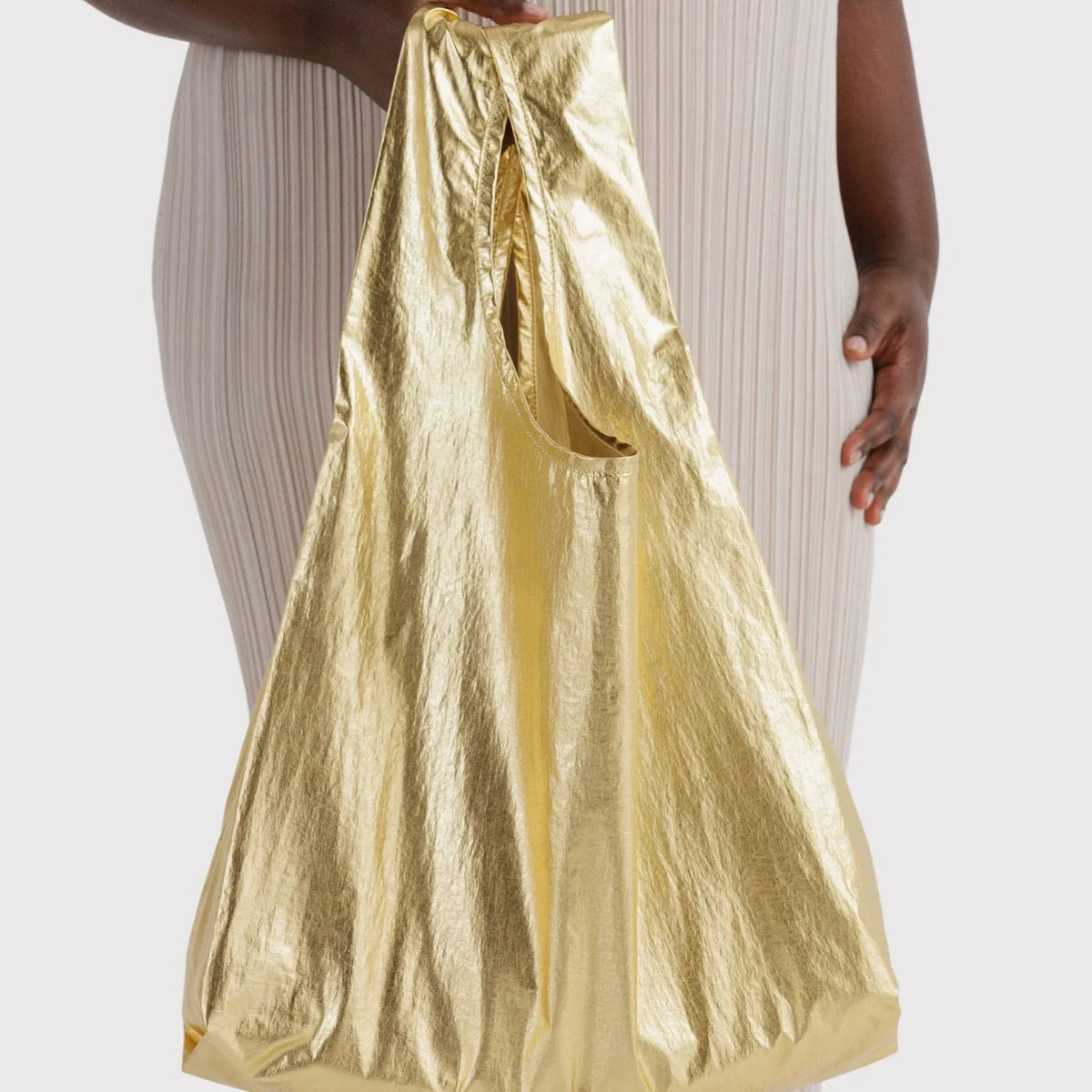 Metallic gold tote bag with gathered top and large capacity