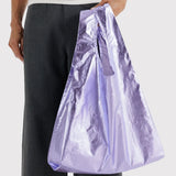 Baggu standard bag tote in lavender metallic, held open with long gathered top