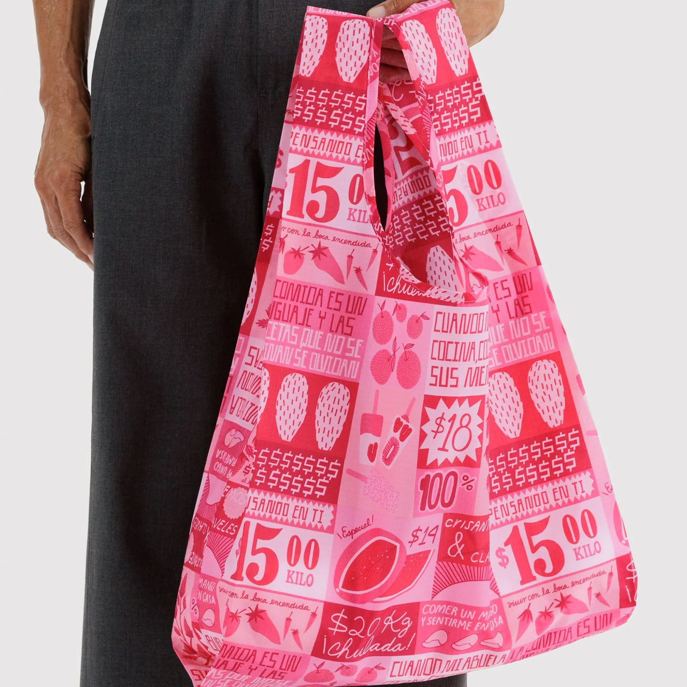 Pink printed tote bag held by a person, Mercado-style grocery shopper bag