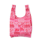 Pink reusable grocery tote bag with all-over Mercado-style print